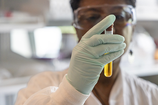 Woman holding Test Tube